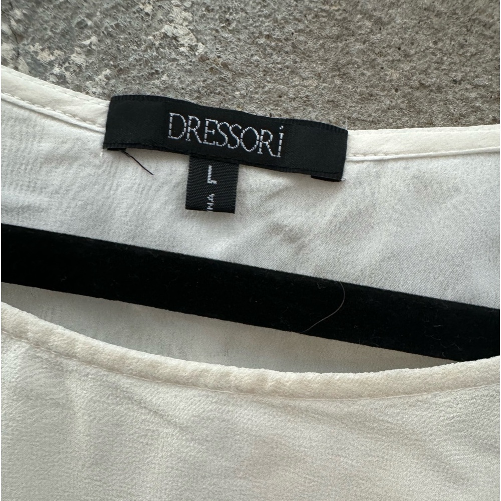 Dresser double lines cream colored tank top